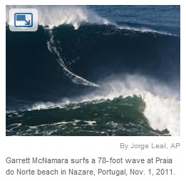 IMAGE- Garrett McNamara surfs a 78-foot wave on All Hallows Day, 2011